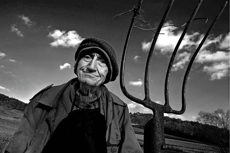 628 - old farmer with fork - BORKO IVO - slovenia.jpg